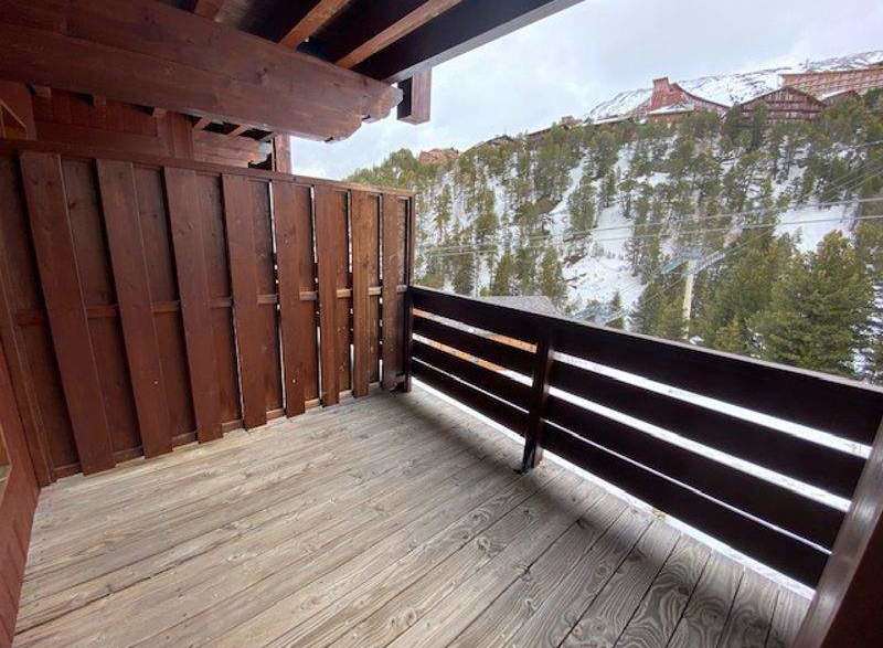 Enjoy breathtaking mountain views from this charming balcony.