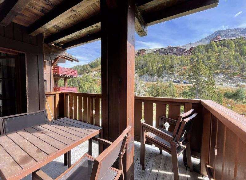 Enjoy breathtaking mountain views from this charming balcony.