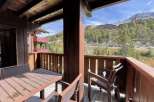 Enjoy breathtaking mountain views from this charming balcony.