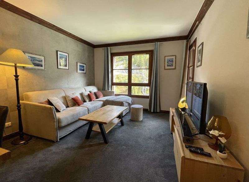 Cozy living room with a comfortable sofa and a stylish coffee table.