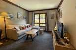 Cozy living room with a comfortable sofa and a stylish coffee table.