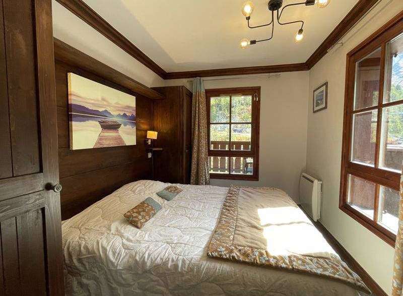 Cozy bedroom with rustic wooden accents.