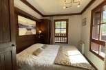 Cozy bedroom with rustic wooden accents.