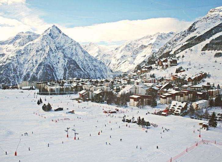 Experience the ultimate winter getaway in this stunning ski resort town nestled amidst majestic snow-capped mountains.