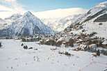 Experience the ultimate winter getaway in this stunning ski resort town nestled amidst majestic snow-capped mountains.