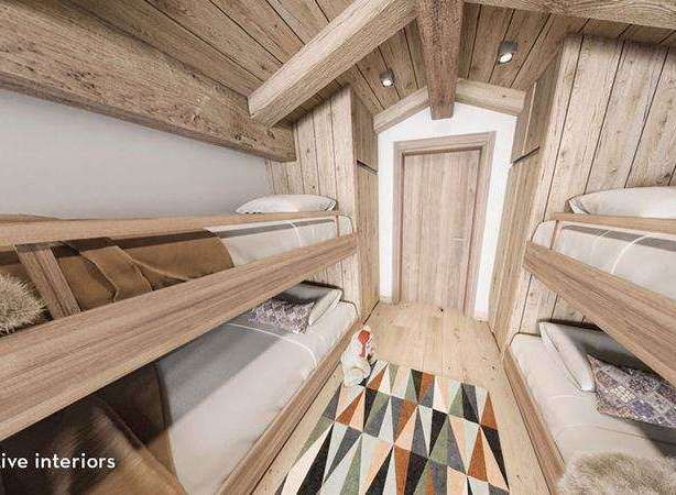 Discover the charm of this cozy cabin interior, featuring rustic wooden bunk beds perfect for a family getaway.