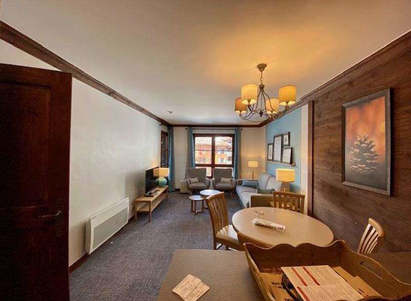 This cozy living space features a charming dining area and comfortable seating, perfect for relaxing after a day of exploring.
