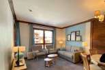 This cozy living space features a comfortable sofa and two armchairs, perfect for relaxing after a day of exploring.