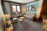 Cozy living space with a comfortable sofa and armchairs, perfect for relaxation.