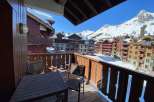 Enjoy breathtaking mountain views from this charming balcony.
