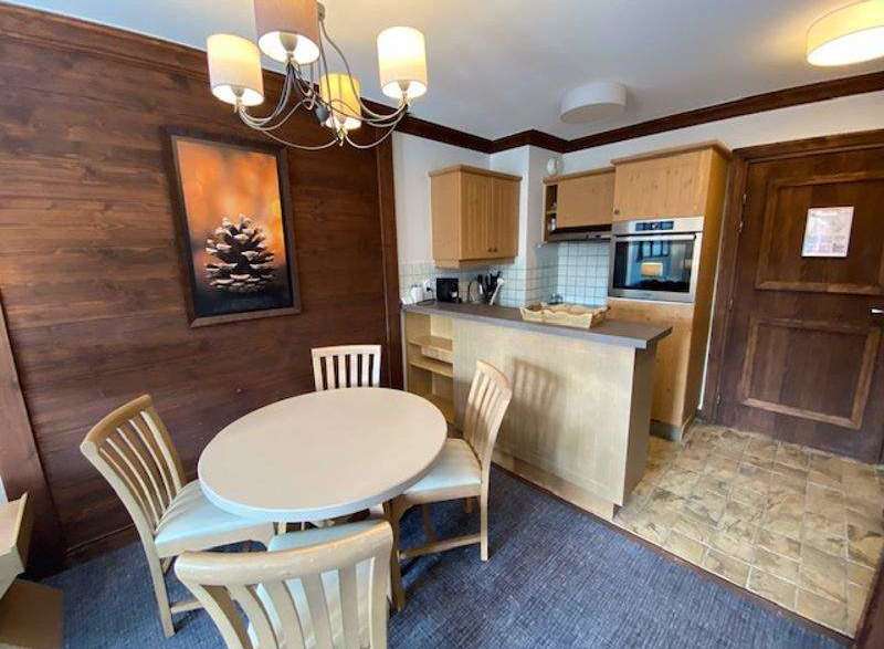 Cozy kitchen with a dining area, perfect for a small family.
