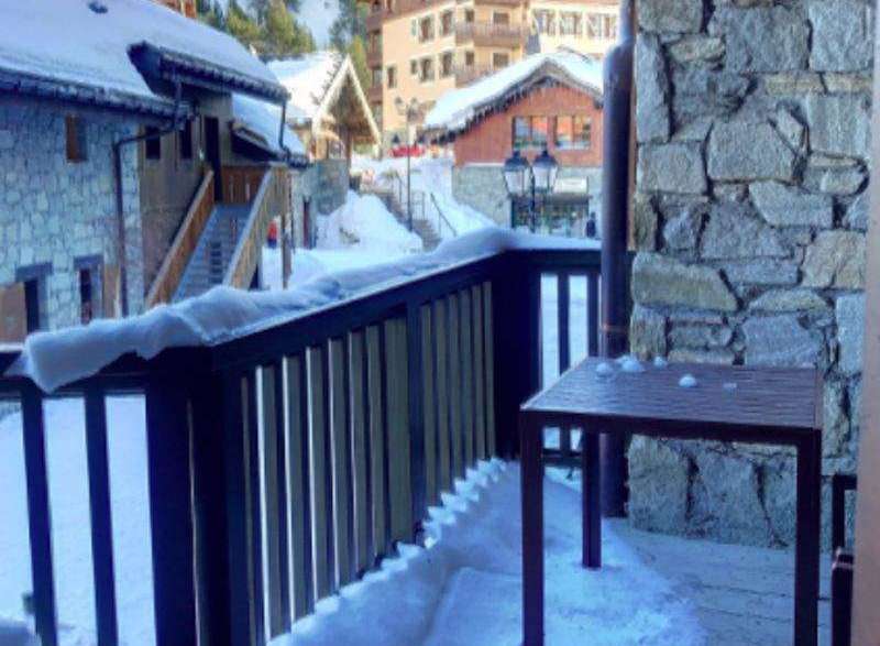 Enjoy breathtaking mountain views from this charming balcony.