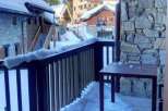 Enjoy breathtaking mountain views from this charming balcony.