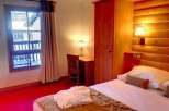 Cozy hotel room with a warm and inviting atmosphere.