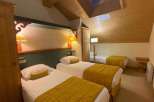 Discover a cozy and inviting bedroom with a unique architectural design.