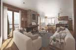 Experience luxury living in this stunning property, featuring a cozy fireplace and elegant wooden accents.