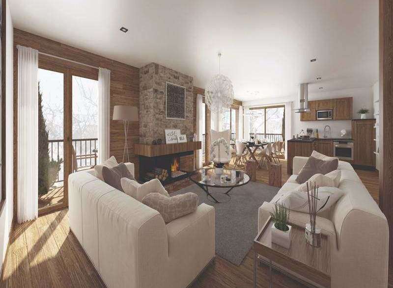 Experience luxury living in this stunning property, featuring a cozy fireplace and elegant wooden accents.
