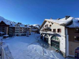 Experience the charm of this snow-covered property, perfect for a winter getaway.