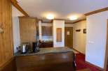 Cozy kitchen with wooden cabinets and a countertop, perfect for preparing meals.