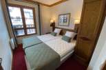 Cozy bedroom featuring two twin beds with comfortable mattresses and soft bedding.