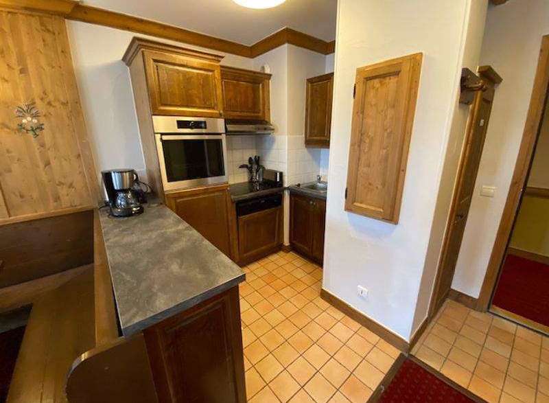Discover a charming kitchen with wooden cabinetry and a built-in oven, perfect for preparing delicious meals.