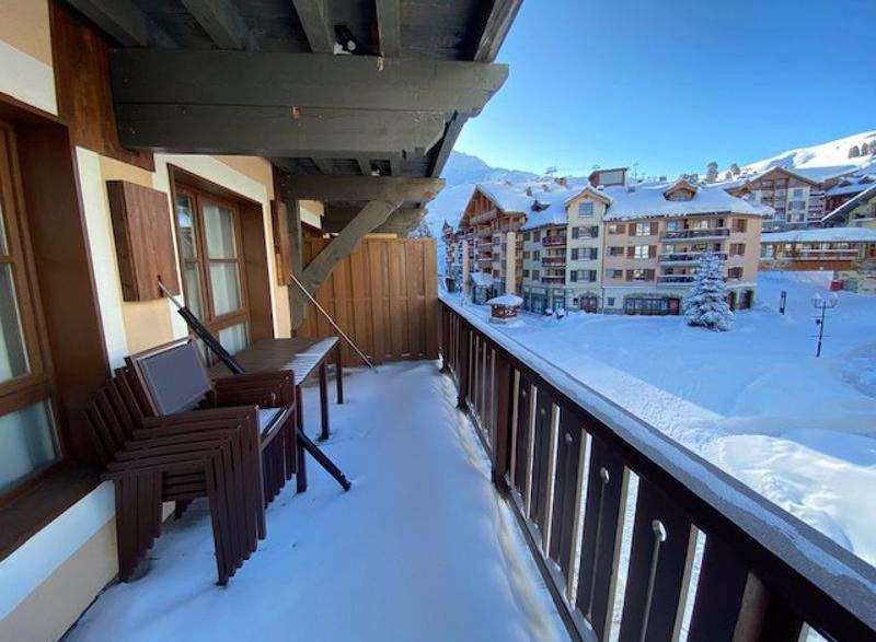 Enjoy breathtaking mountain views from this charming balcony.