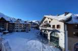 Experience the charm of this snow-covered property, perfect for a winter getaway.