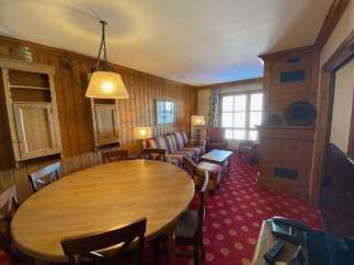 Step into a cozy retreat with this charming property, featuring warm wooden accents and a welcoming atmosphere.