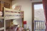 Cozy bedroom with bunk beds, perfect for a family getaway.