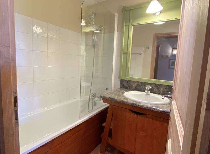 Discover a charming bathroom with a bathtub and shower combination, perfect for relaxation.
