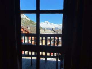 Enjoy breathtaking mountain views from this charming property.