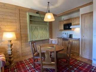 Cozy apartment with a charming dining area, perfect for enjoying meals.