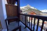 Enjoy breathtaking mountain views from this charming balcony.