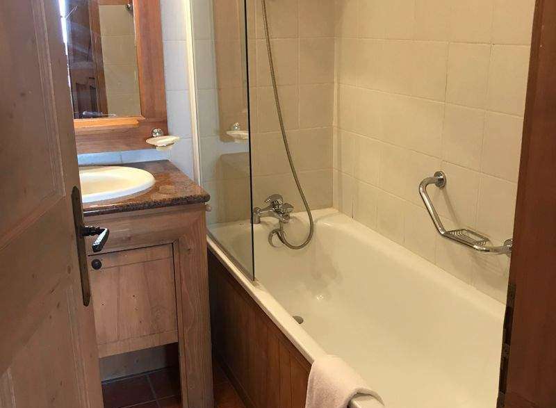 Discover a charming bathroom with a bathtub and shower combination.