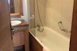 Discover a charming bathroom with a bathtub and shower combination.
