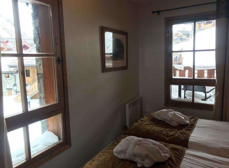 Cozy bedroom with stunning mountain views.
