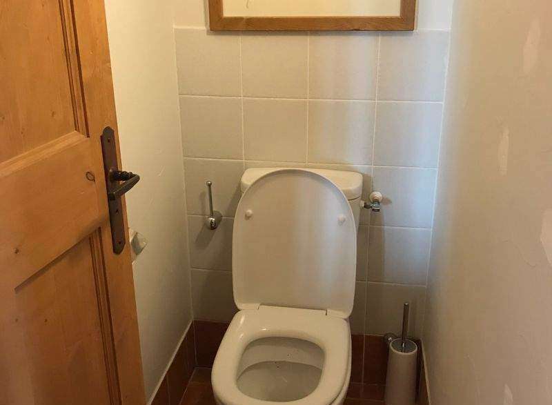 This charming property features a well-appointed bathroom with a modern toilet.