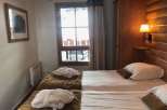 Cozy bedroom with twin beds, perfect for a relaxing stay.