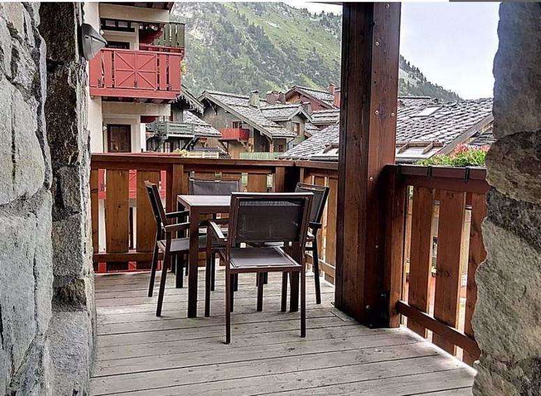 Enjoy breathtaking mountain views from this charming balcony.