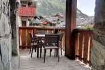 Enjoy breathtaking mountain views from this charming balcony.