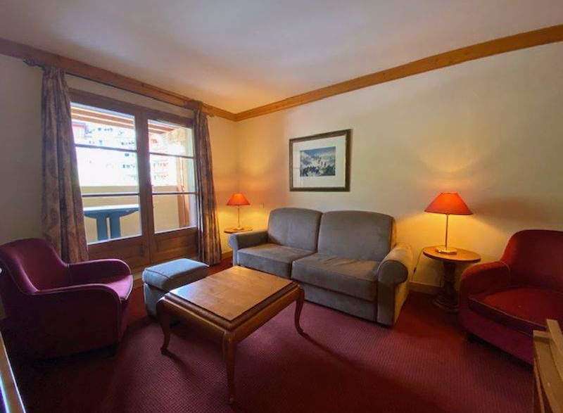 Cozy living room with a comfortable sofa and armchair, perfect for relaxing after a day of exploring.