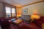 Cozy living room with a comfortable sofa and armchair, perfect for relaxing after a day of exploring.