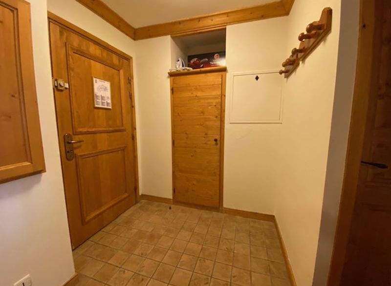 This charming property features a warm and inviting entryway with wooden doors and trim.