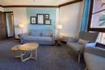 Cozy living room with a comfortable sofa and armchairs, perfect for relaxing.