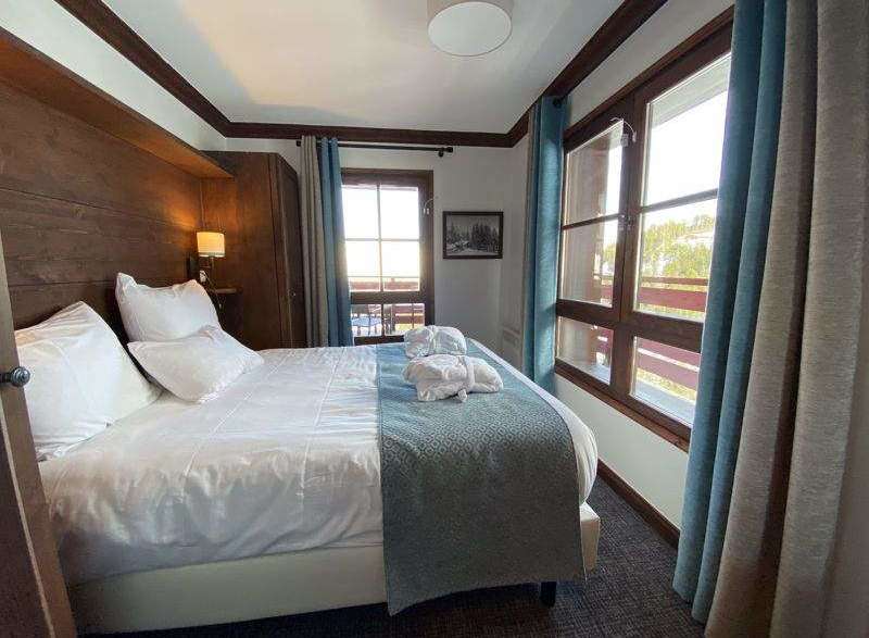 Cozy bedroom with a comfortable bed and soft linens.