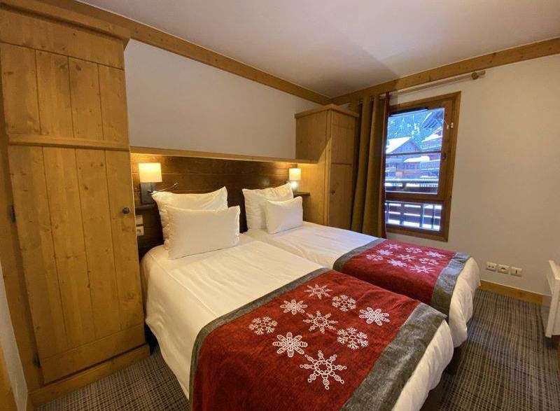 Cozy bedroom with two twin beds, perfect for a comfortable stay.