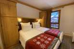 Cozy bedroom with two twin beds, perfect for a comfortable stay.