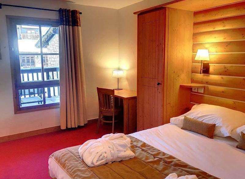 Cozy hotel room with a warm and inviting atmosphere.