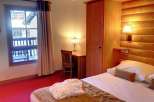 Cozy hotel room with a warm and inviting atmosphere.