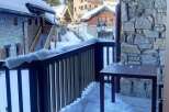 Enjoy breathtaking mountain views from this charming balcony.